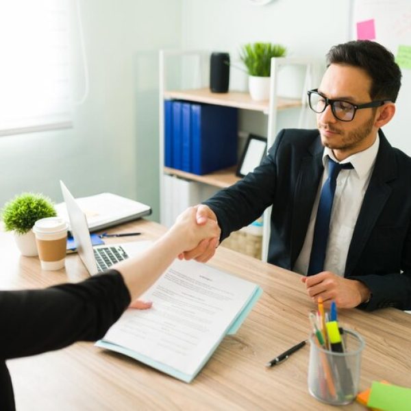 business-partner-suit-shaking-hands-with-caucasian-professional-colleague-blond-woman-signing-deal-contract-with-lawyer-corporate-office_662251-209