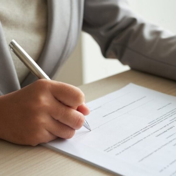 cropped-anonymous-business-woman-checking-agreement-before-signing_1098-18907 (1)