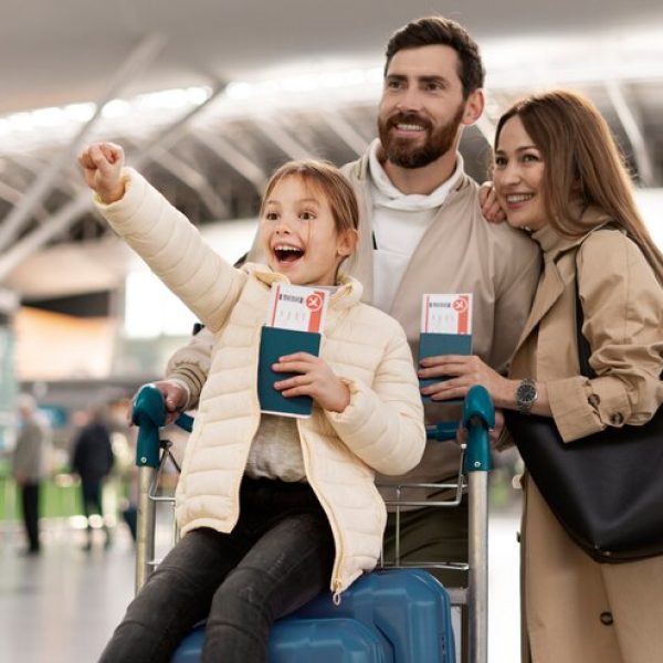 medium-shot-happy-family-airport_23-2149272153